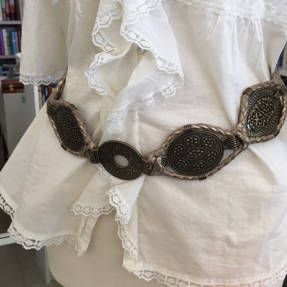 Chico’s brass belt with stretch snap back.